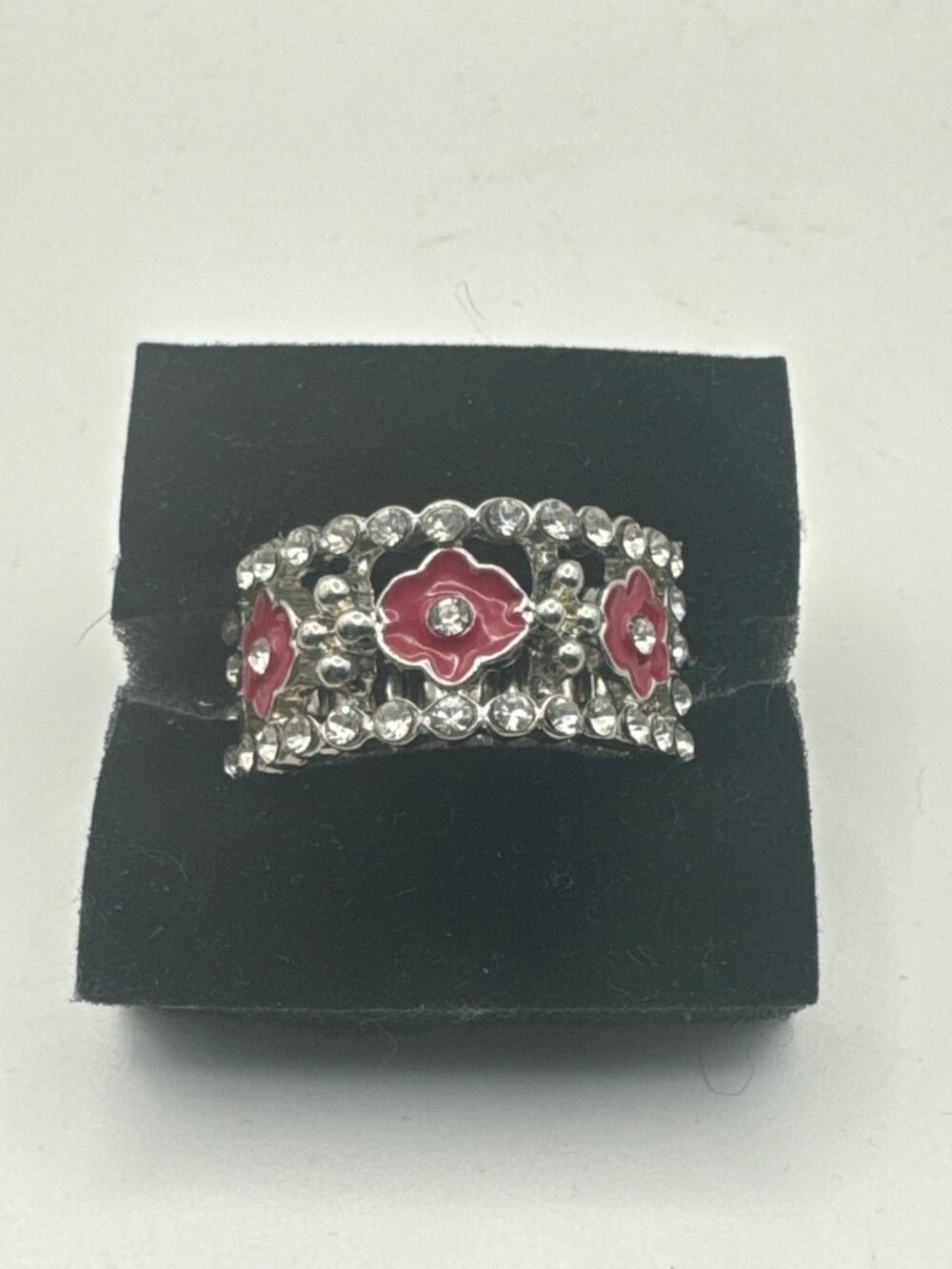 Unique Silver Stretch Ring With Intricate Floral Design & Pink Accents